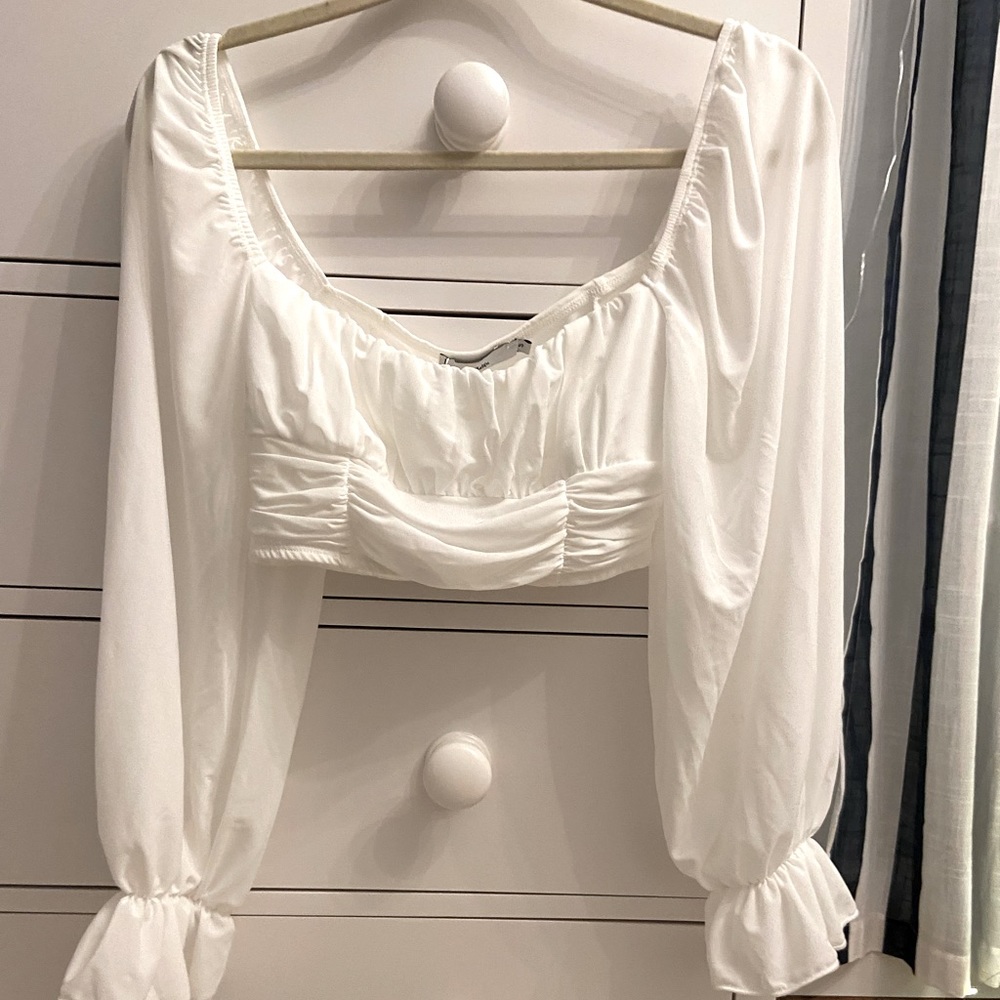 white ruffle blouse